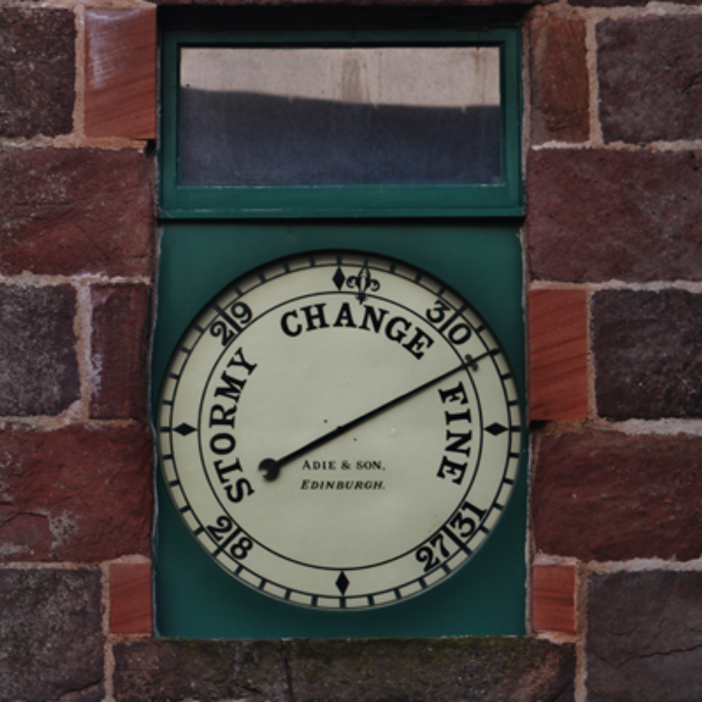 Barometer on a brick wall 