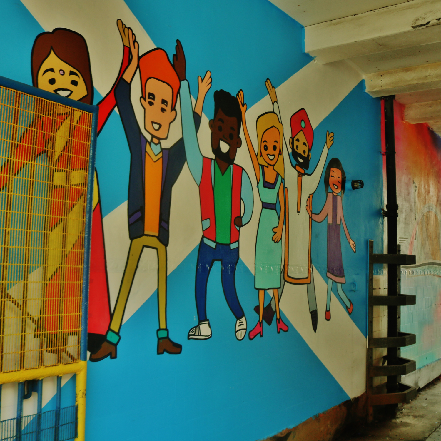 Colourful mural on a wall celebrating diversity and community
