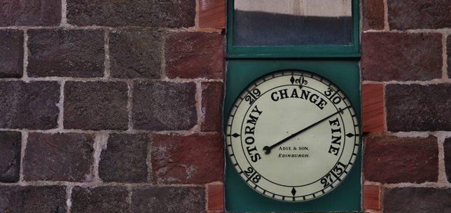 Barometer on a brick wall