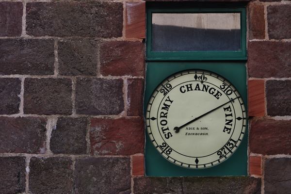 Barometer on a brick wall
