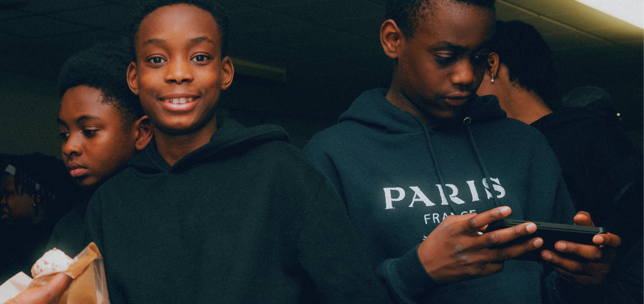 Close up of three children at a community centre