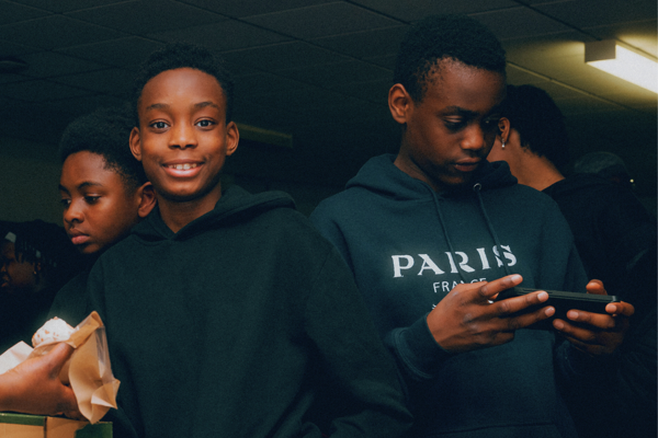 Close up of three children at a community centre