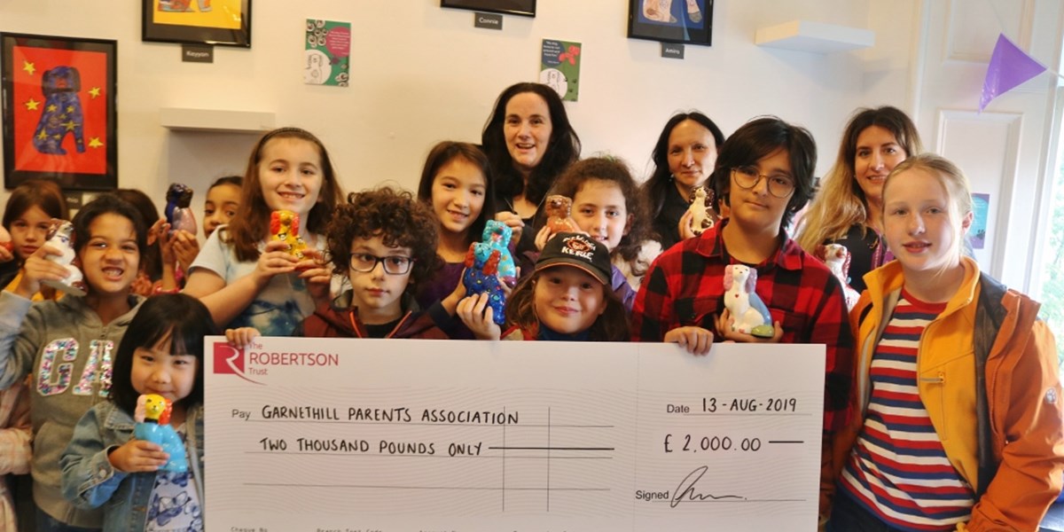 Group from Garnethill Parents Association receiving funding cheque