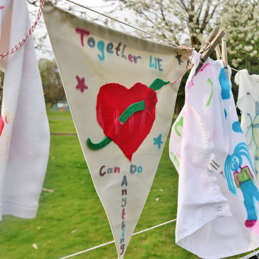 Art materials on a washing line which says 'Together we can do anything'